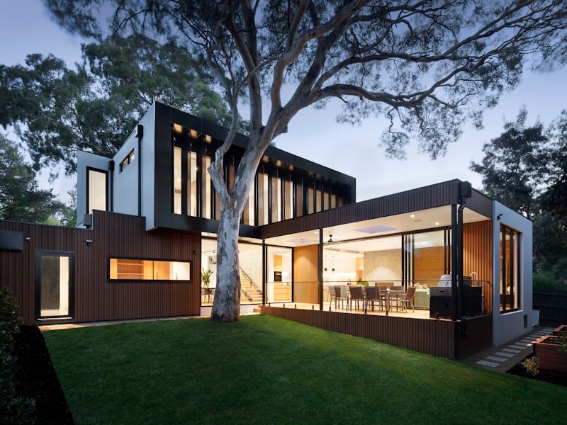 Finished modern Ottawa home exterior with wood deck and yard