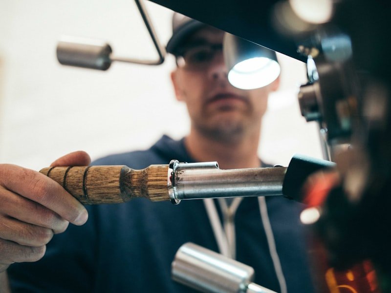 Craftsman fitting wooden trim moulding with hand tools